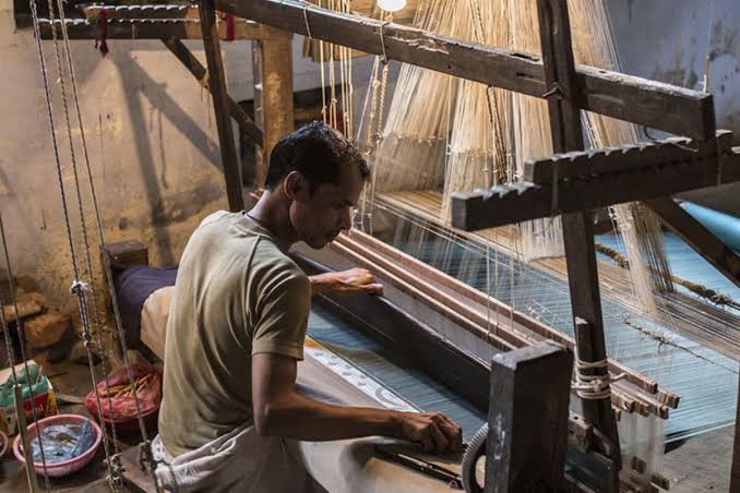 Weaver working on a traditional handloom